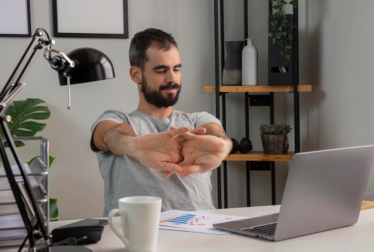 Man Stretching His Arms While Working From Home 23 2148806688