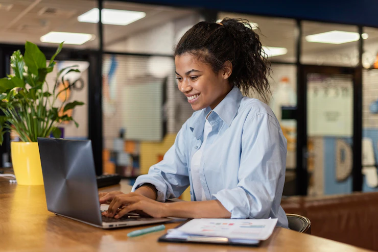 Side View Smiley Woman Working With Laptop Office 23 2148908808